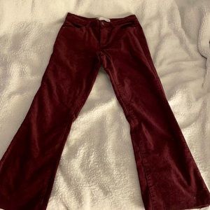 Burgundy jeans flare at the bottom